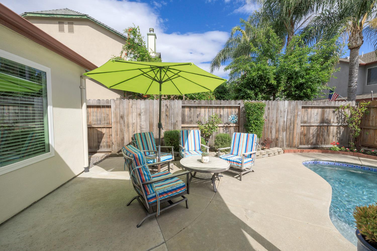 3416 Will Scarlet Way Modesto, CA 95355 - Photo 46 of 56 a view of backyard with swimming pool and table