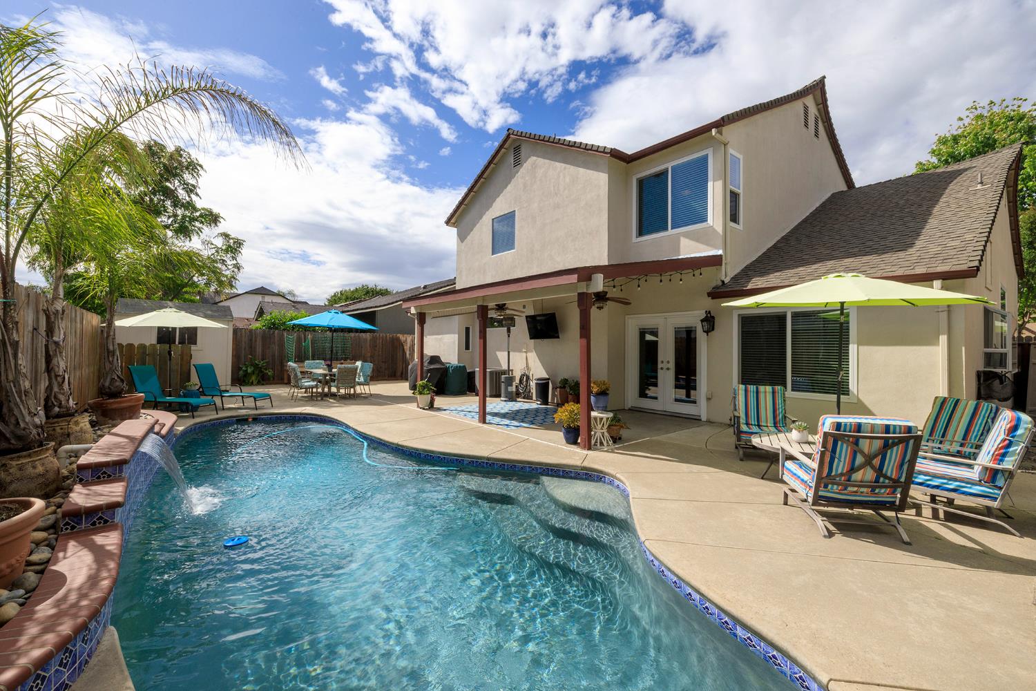 3416 Will Scarlet Way Modesto, CA 95355 - Photo 47 of 56 a view of a house with swimming pool and sitting area