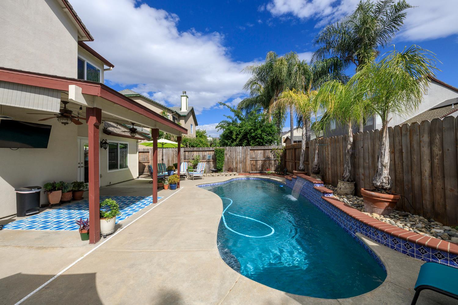 3416 Will Scarlet Way Modesto, CA 95355 - Photo 52 of 56 a view of a swimming pool with a patio