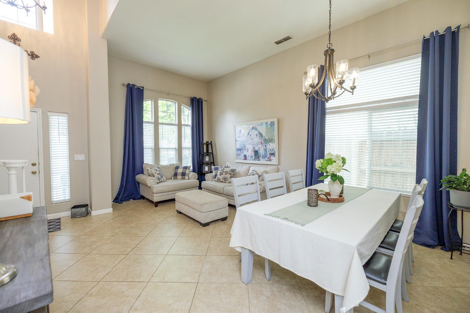 3416 Will Scarlet Way Modesto, CA 95355 - Photo 6 of 56 a view of a dining room with furniture window and outside view