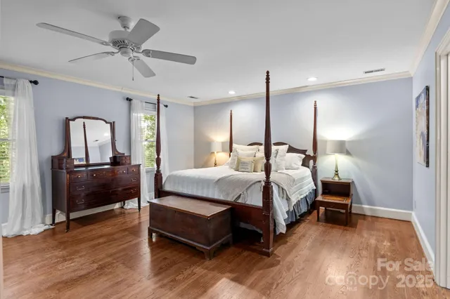 a bed room with a bed and a chandelier