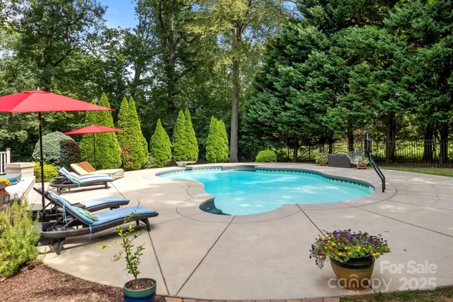 a view of a backyard with sitting area