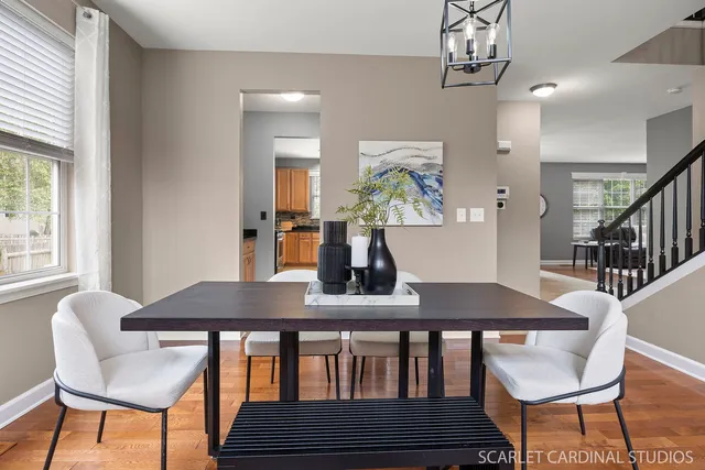 a view of a dining room with furniture and a window