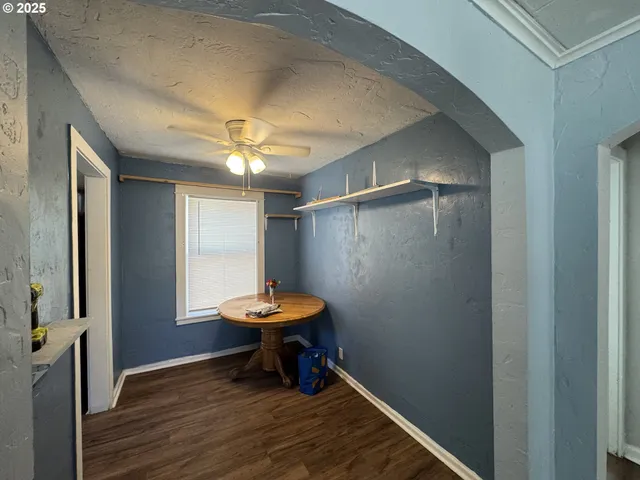 a view of room with a wooden floor and a window