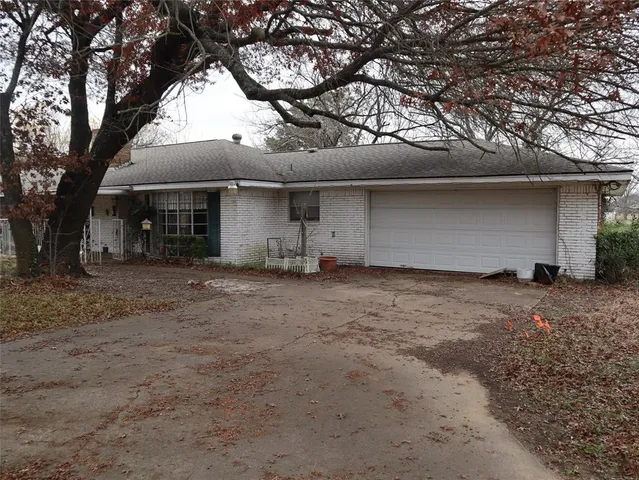 a view of house with yard