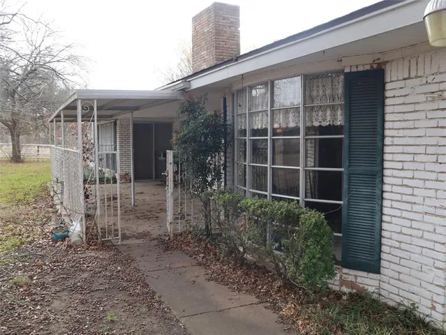 a view of a door and chair in the patio