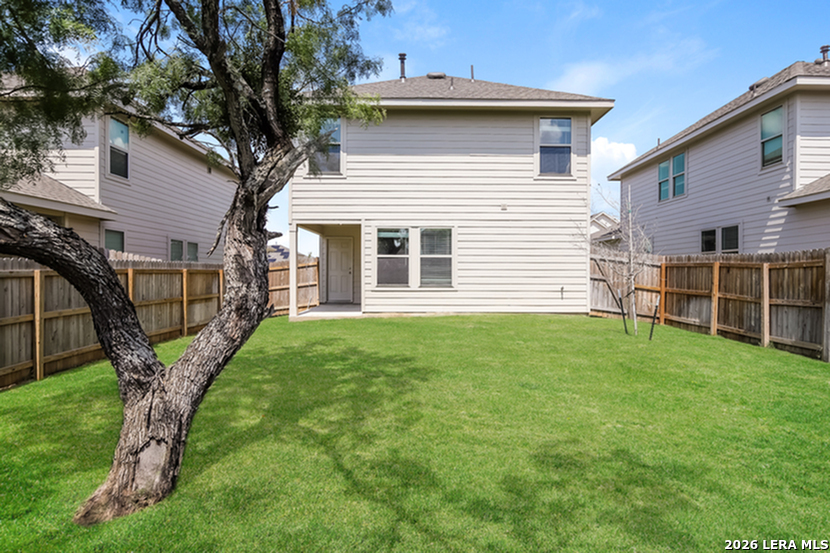 5122 Blue Ranch San Antonio, TX 78222 - Photo 2 of 16 a view of a house with a yard