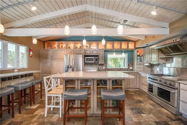 a kitchen with a stove and a sink
