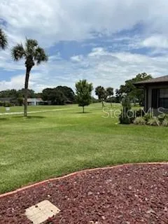 a view of a golf course with a lake