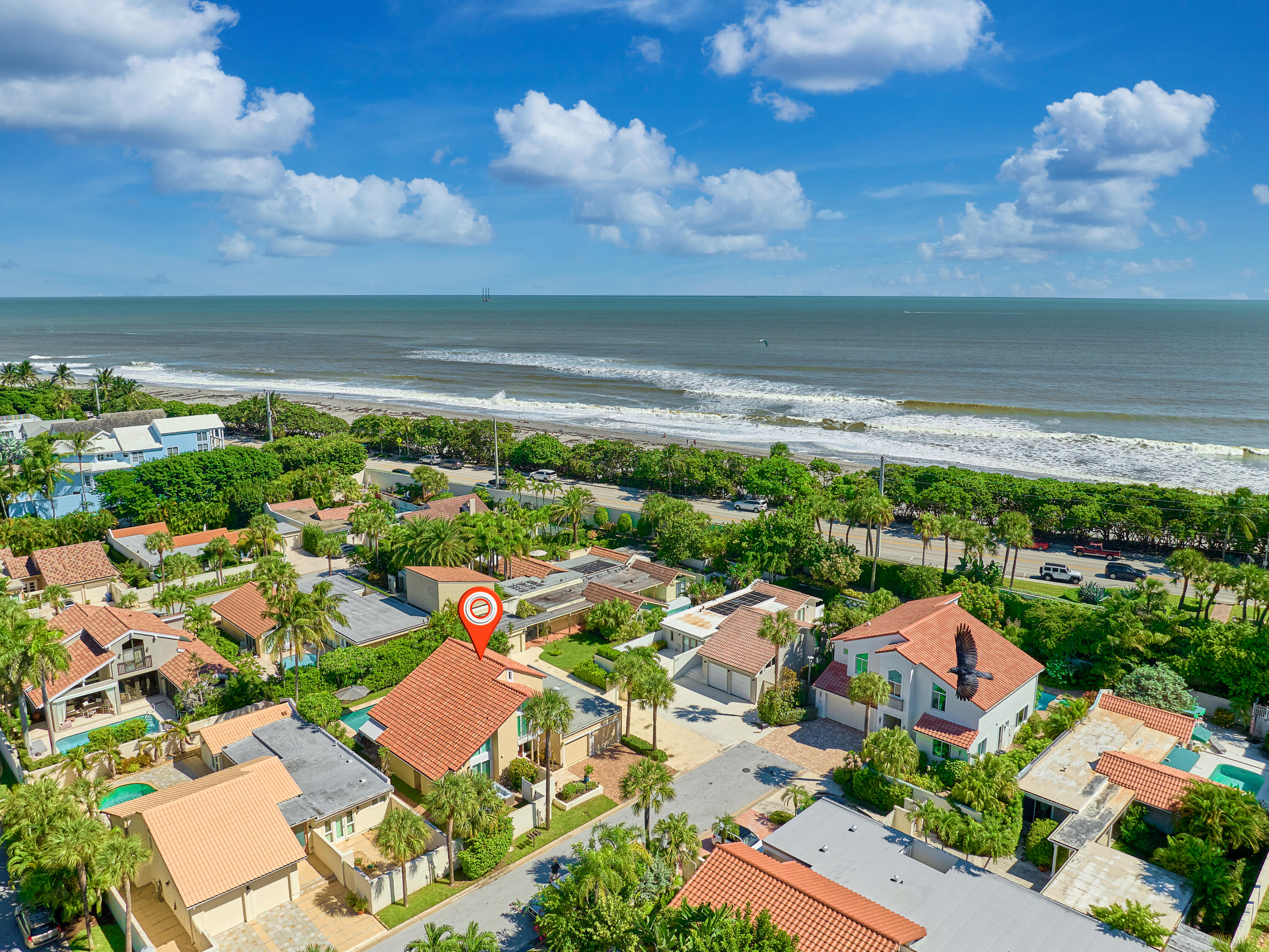 an aerial view of residential houses with outdoor space