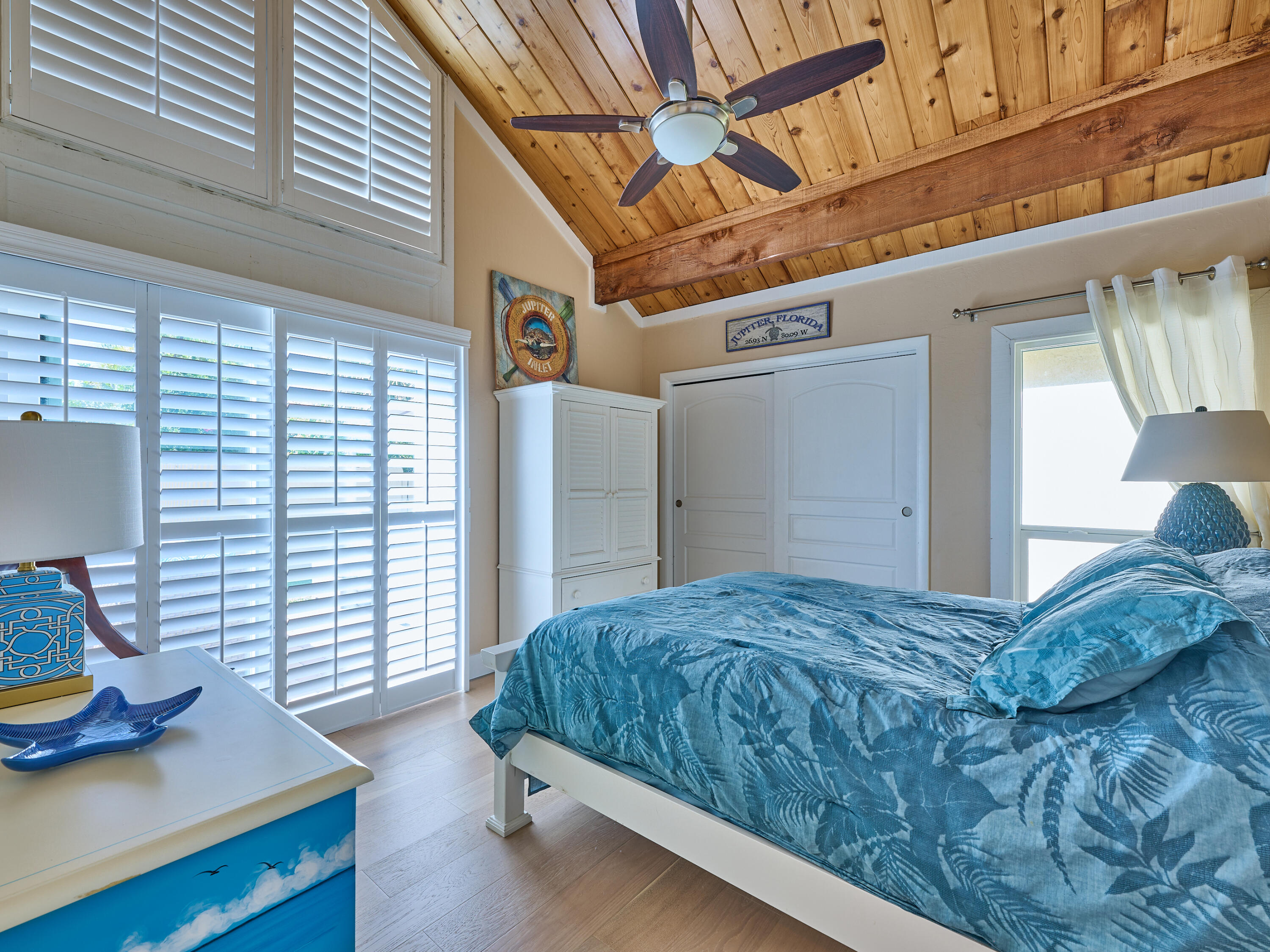 Undisclosed Address Jupiter, FL 33477 - Photo 12 of 20 a bedroom with a bed and a window