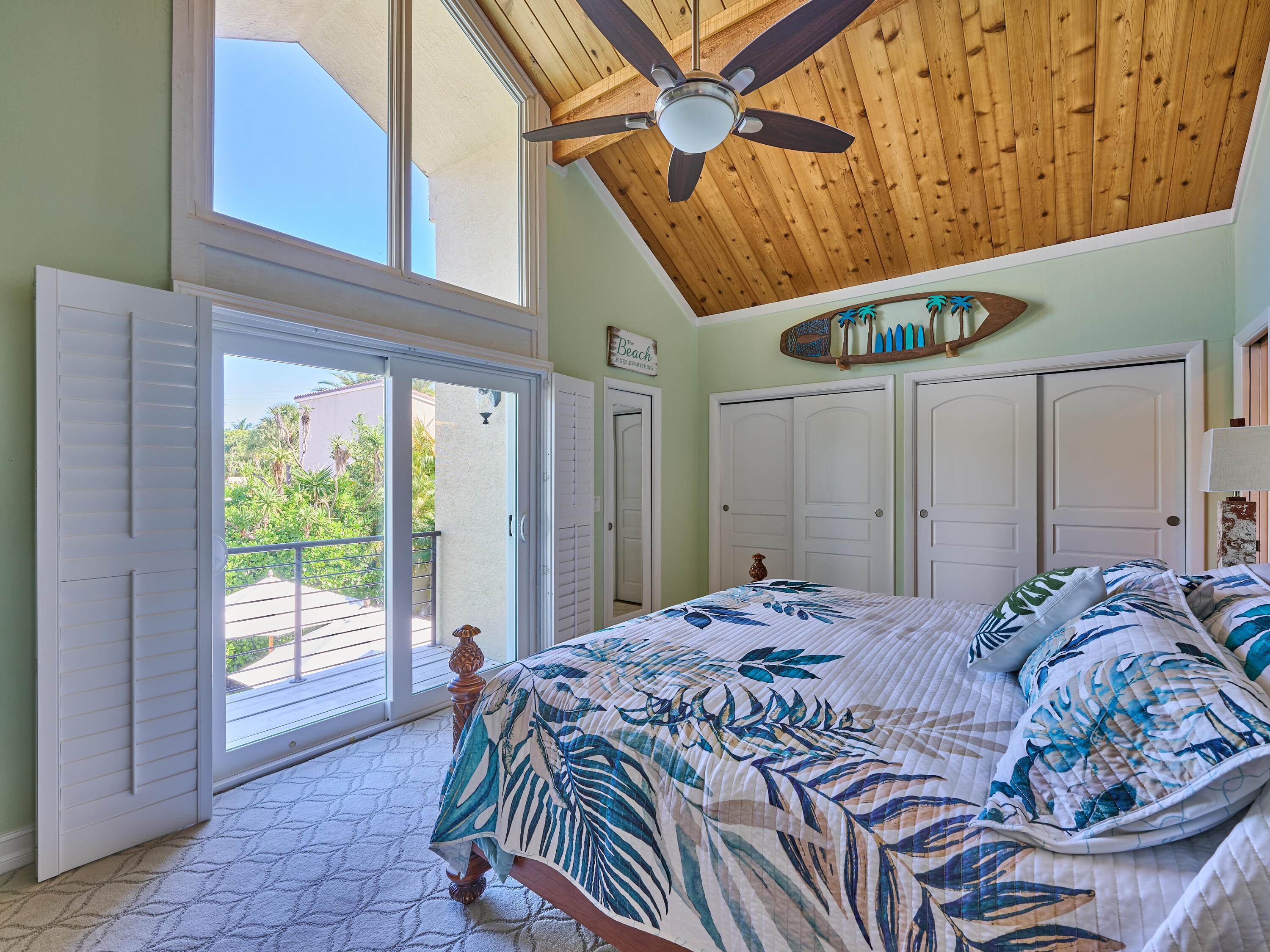 Undisclosed Address Jupiter, FL 33477 - Photo 13 of 20 a bed sitting in a bedroom next to a window