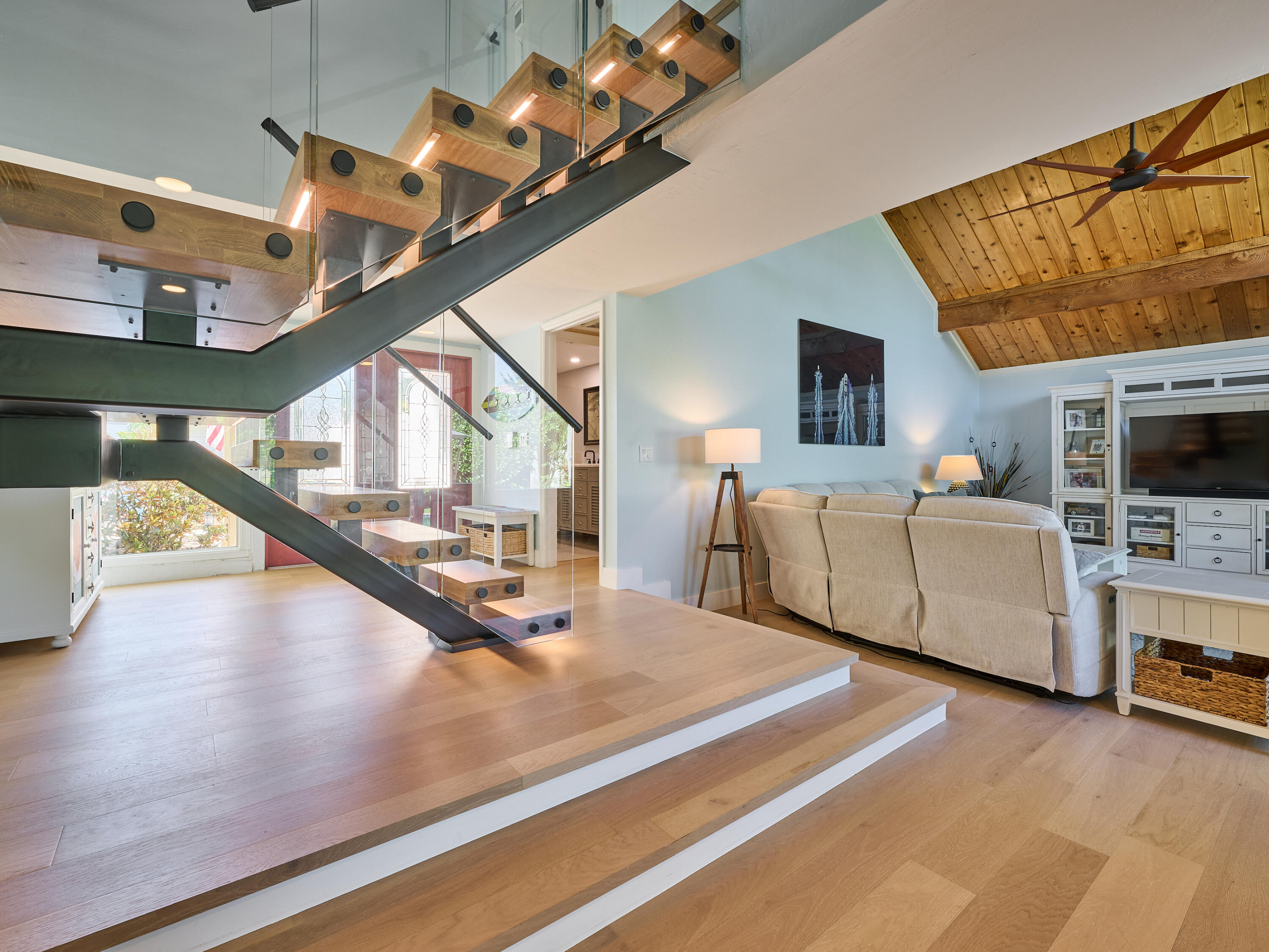 Undisclosed Address Jupiter, FL 33477 - Photo 3 of 20 a living room with furniture and a flat screen tv