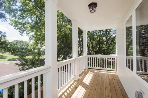 a view of a porch with wooden floor