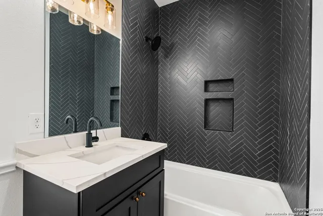 a bathroom with a sink and a bathtub