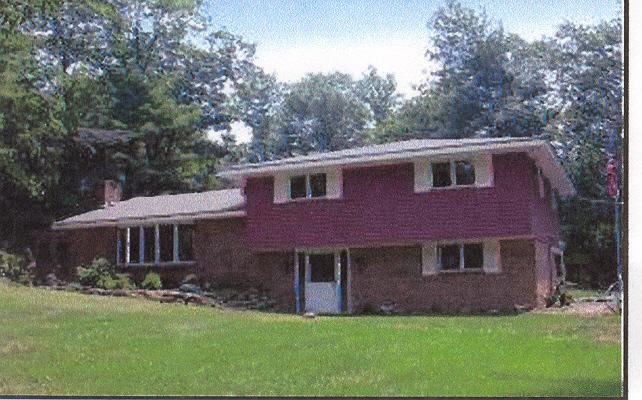 R Pope Road Stroudsburg, PA 18360 - Photo 1 of 1 a front view of a house with a garden