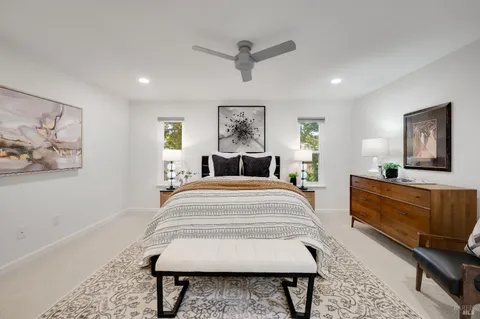 a bedroom with a bed and a couch