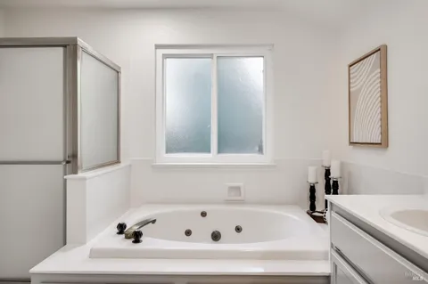 a view of a house with a big yard plants and large trees