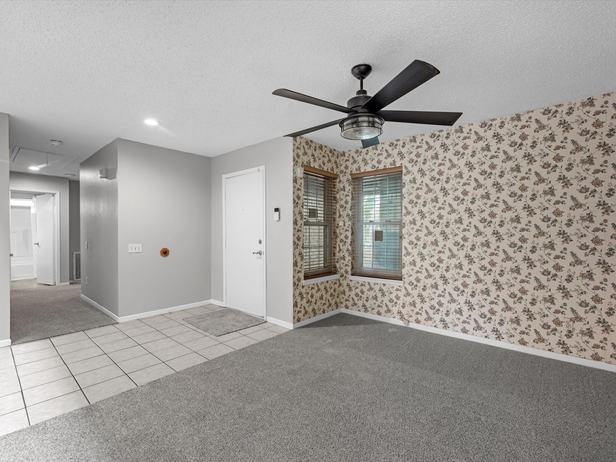 7735 Leafbrook Lane Spring, TX 77379 - Photo 12 of 27 a view of a livingroom with a ceiling fan and window