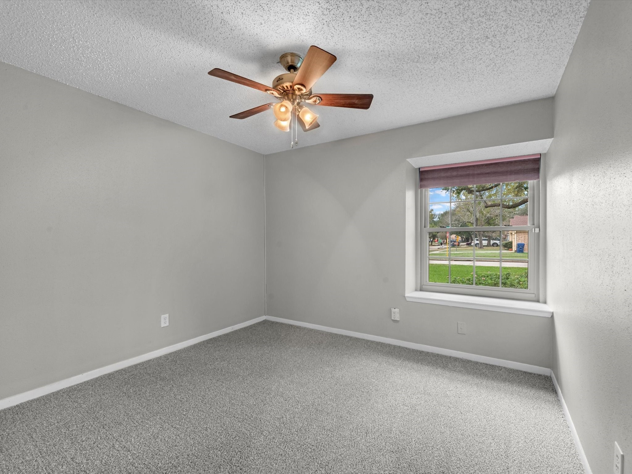 7735 Leafbrook Lane Spring, TX 77379 - Photo 20 of 27 an empty room with windows and fan