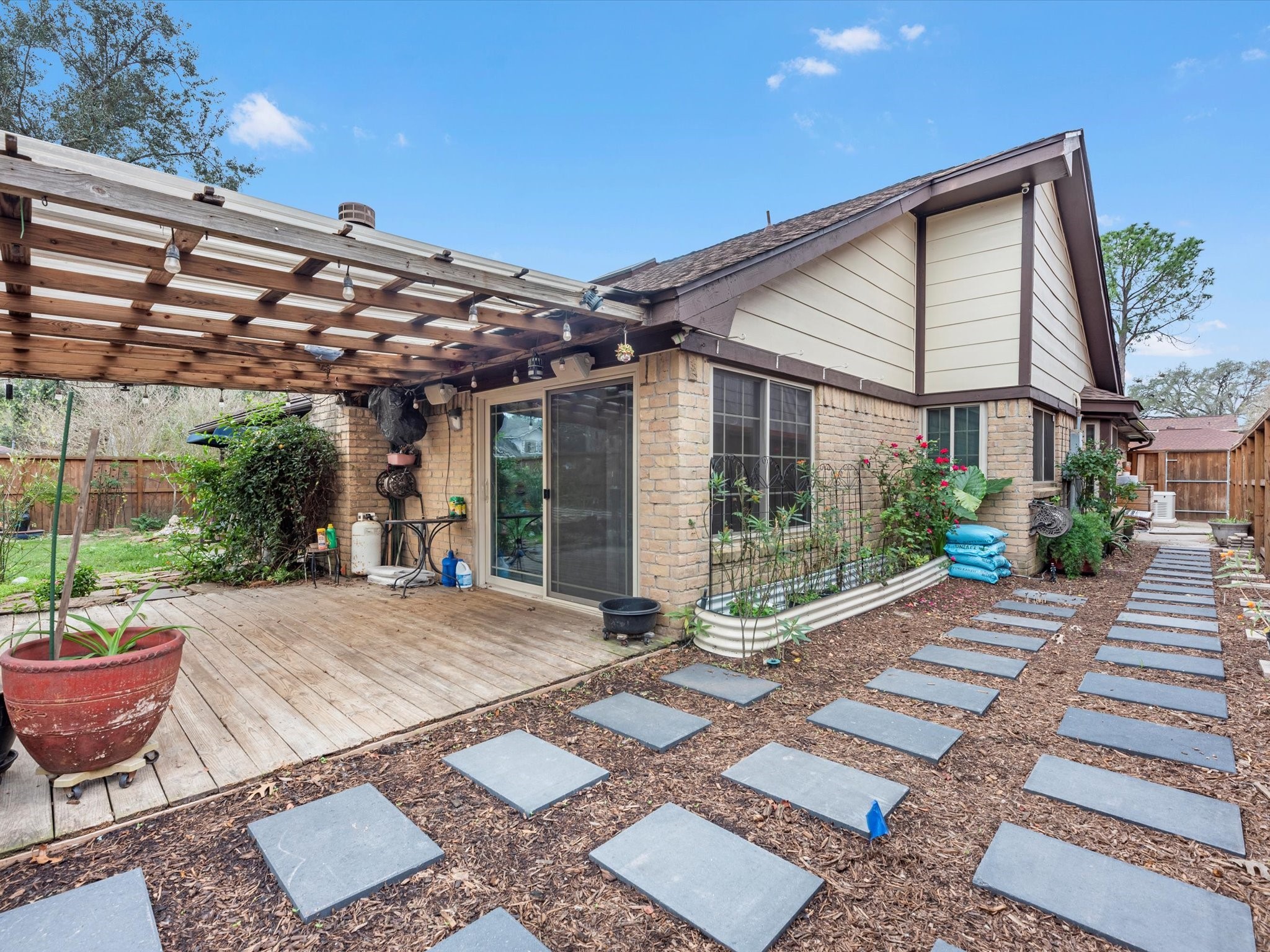 7735 Leafbrook Lane Spring, TX 77379 - Photo 22 of 27 a view of a patio with table and chairs and potted plants