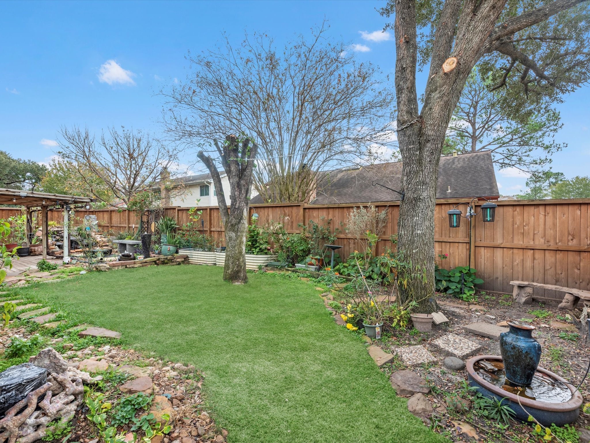 7735 Leafbrook Lane Spring, TX 77379 - Photo 26 of 27 a view of a backyard with sitting area and tree s