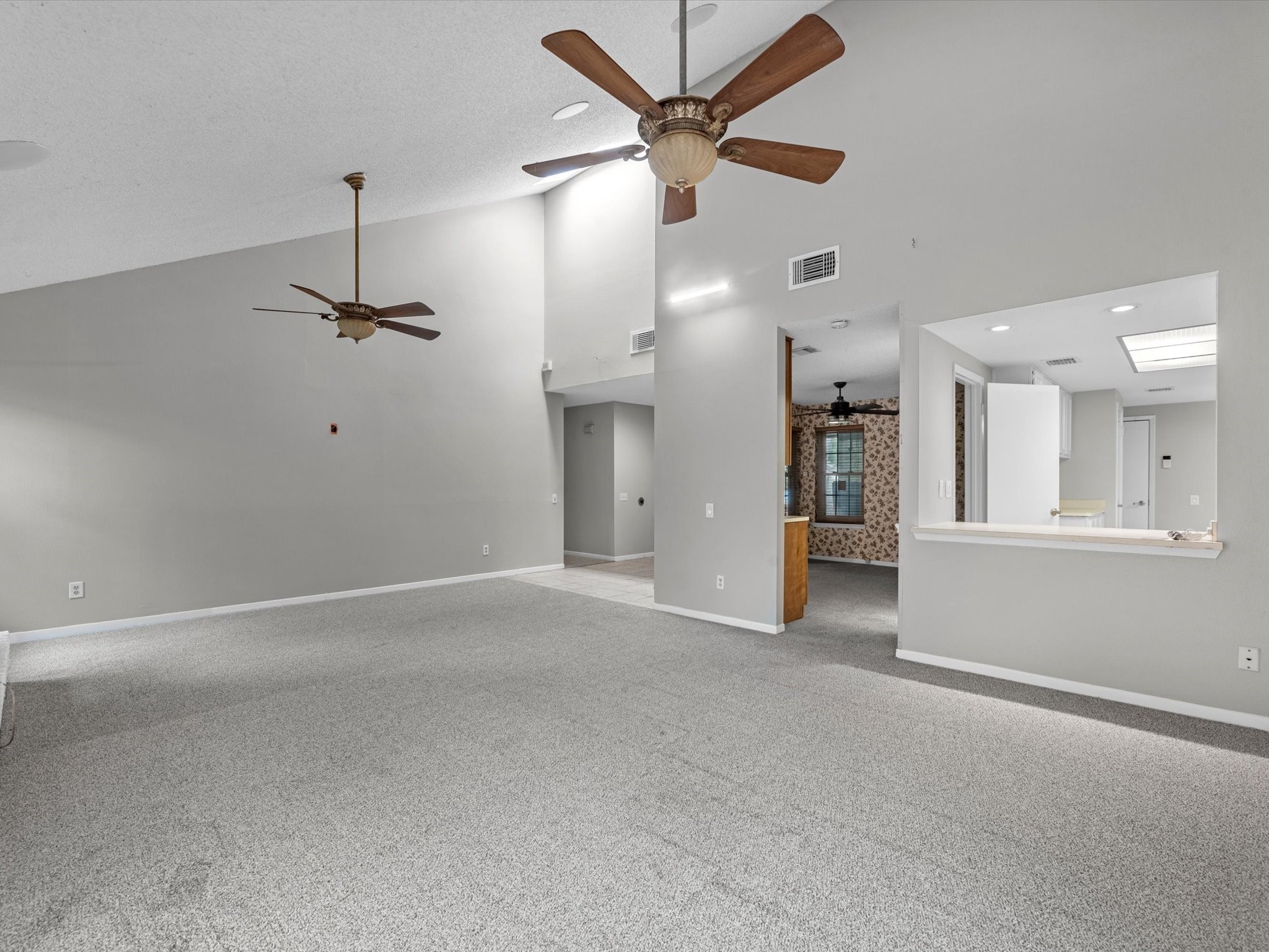 7735 Leafbrook Lane Spring, TX 77379 - Photo 6 of 27 an empty room with fan and windows