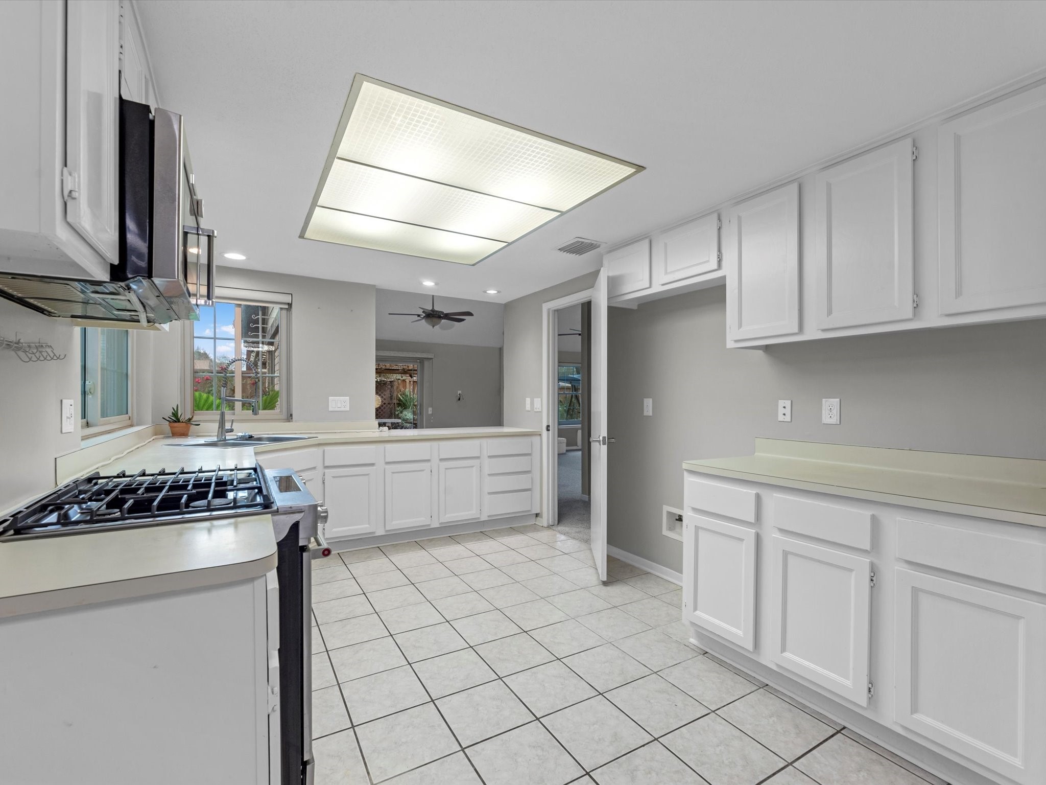 7735 Leafbrook Lane Spring, TX 77379 - Photo 10 of 27 a kitchen with stainless steel appliances a cabinets and a stove top oven