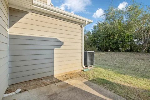 a side view of a house with a garage