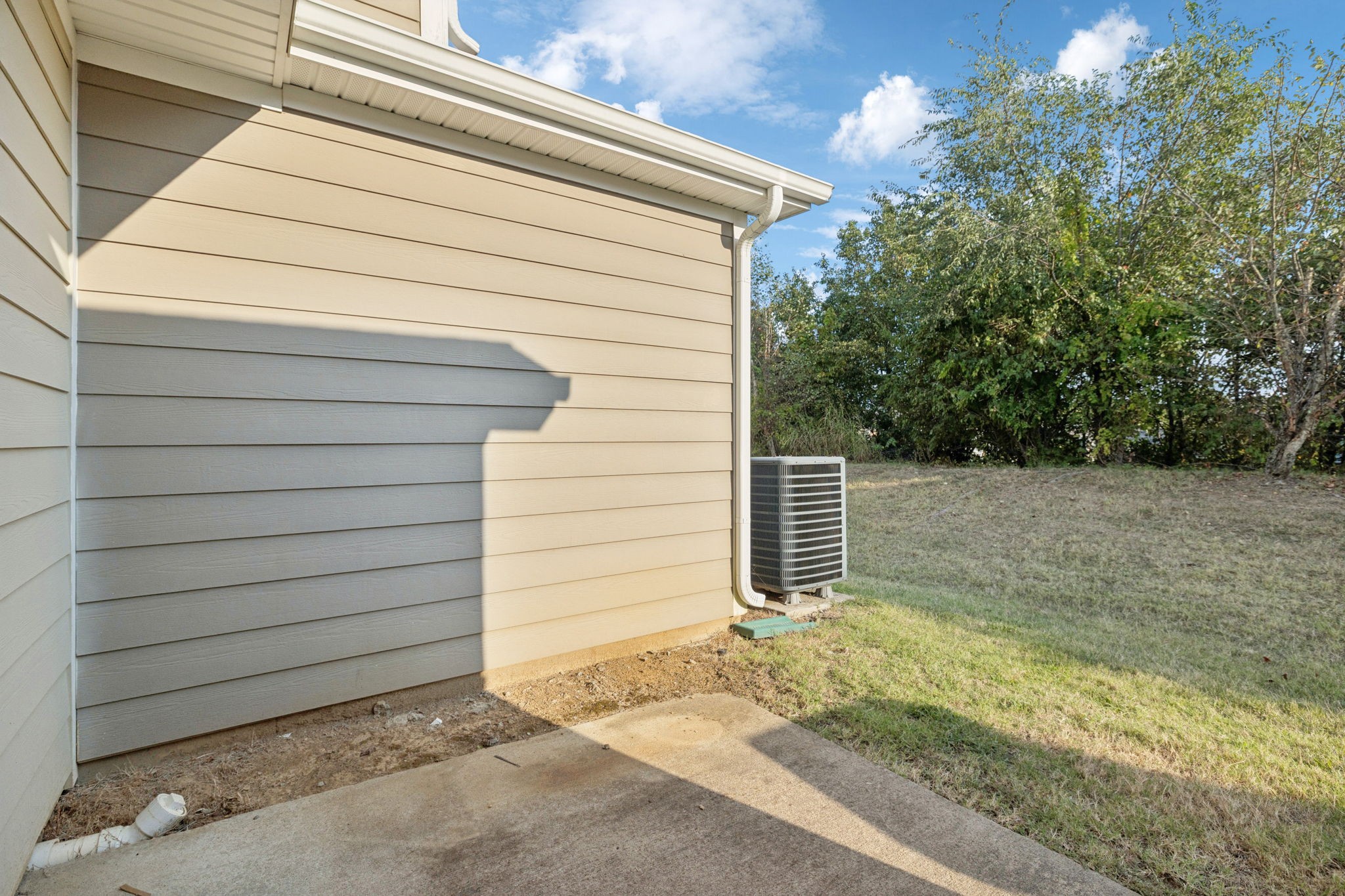 102 Cobblestone Pl Drive Goodlettsville, TN 37072 - Photo 14 of 15 a side view of a house with a garage