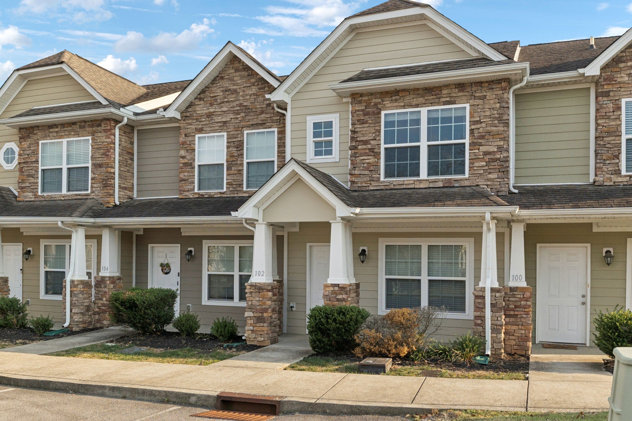 102 Cobblestone Pl Drive Goodlettsville, TN 37072 - Photo 2 of 15 a front view of a house with garden and porch