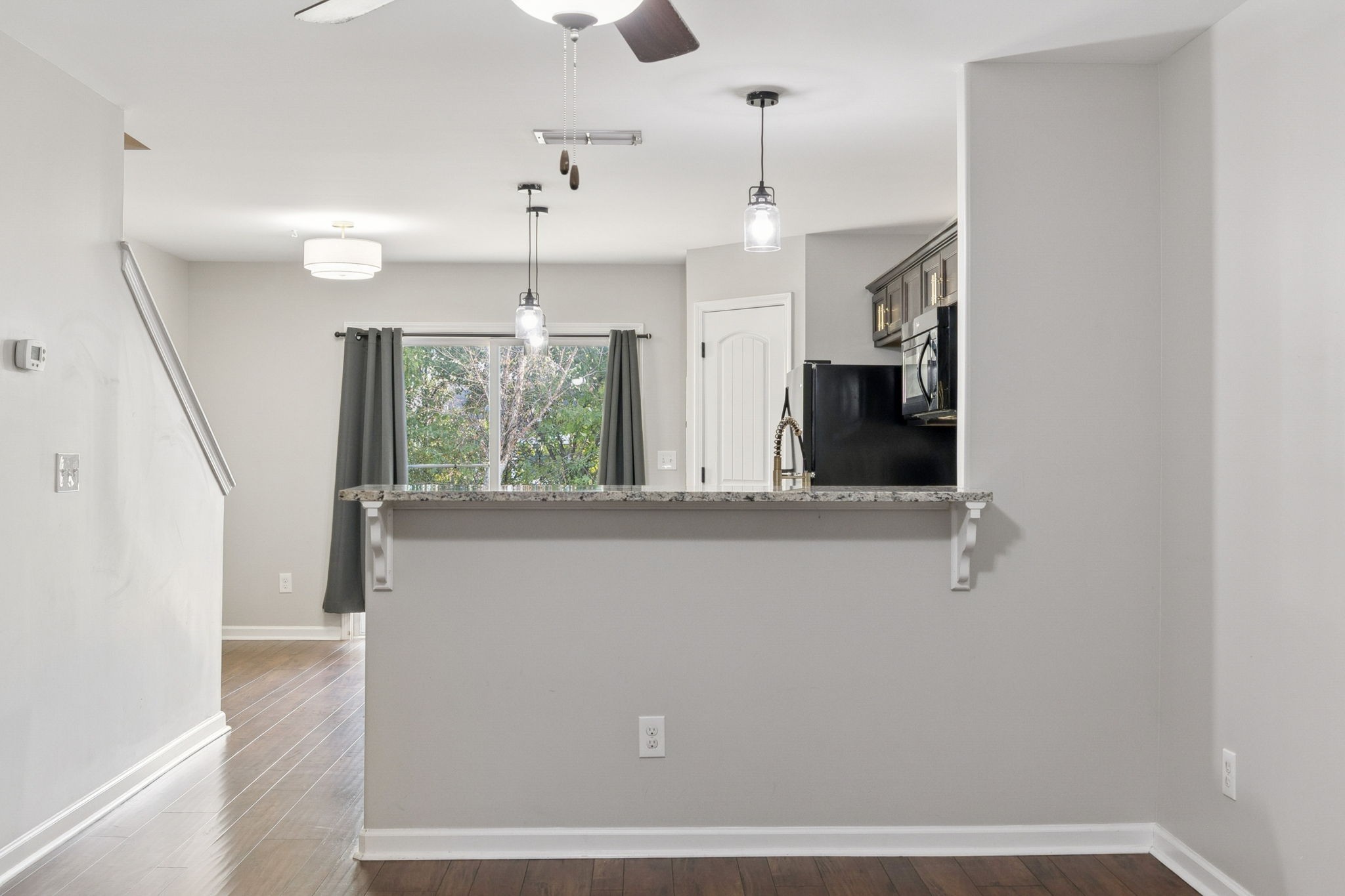 102 Cobblestone Pl Drive Goodlettsville, TN 37072 - Photo 4 of 15 a view of an empty room with wooden floor and a window