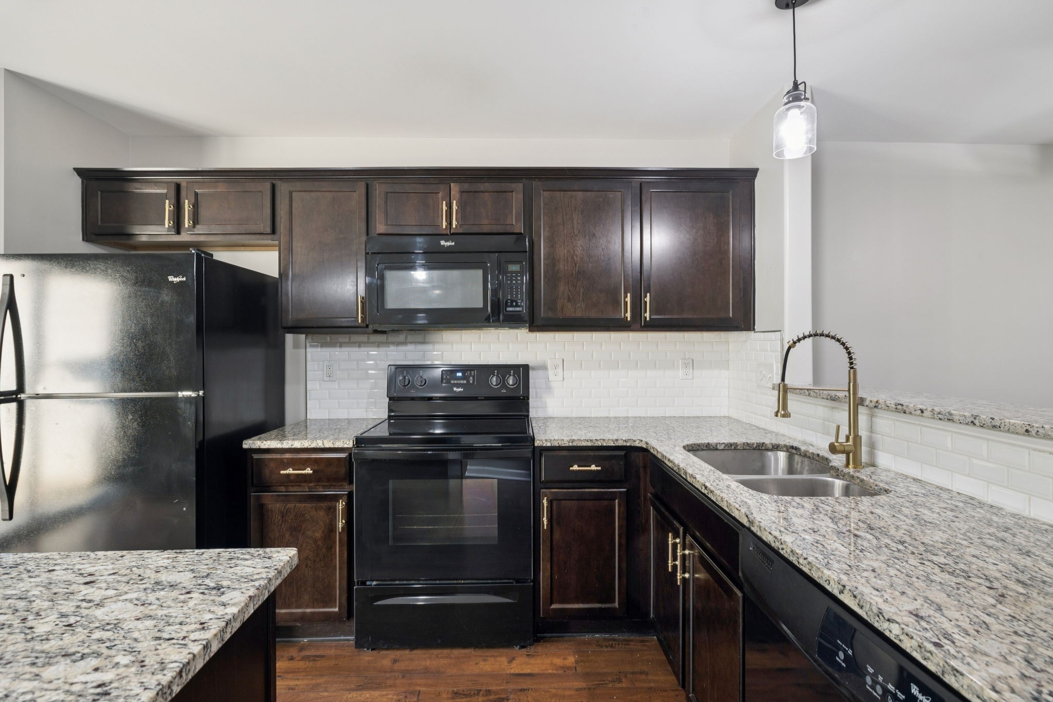 102 Cobblestone Pl Drive Goodlettsville, TN 37072 - Photo 6 of 15 a kitchen with kitchen island granite countertop a sink stainless steel appliances and cabinets
