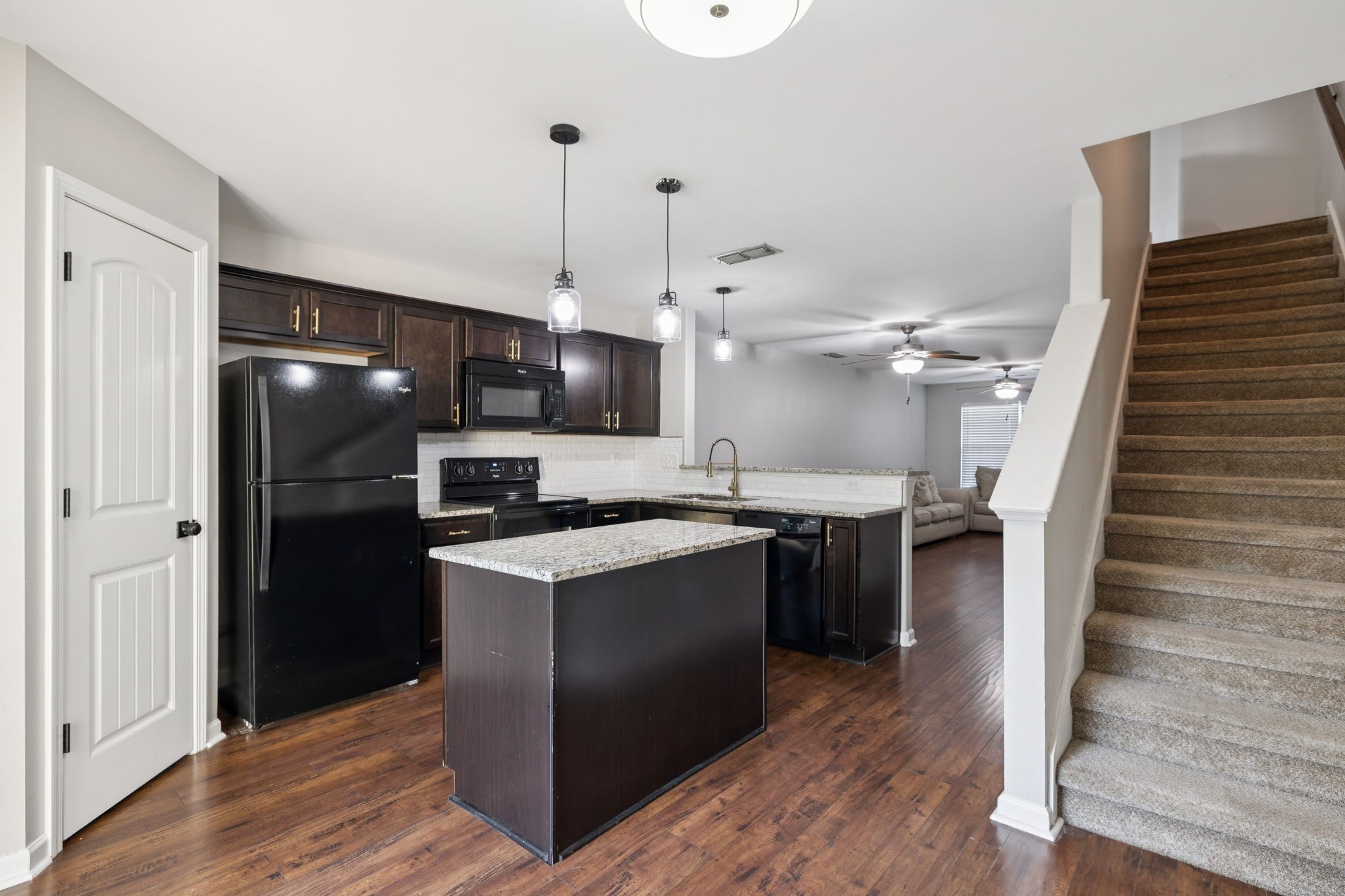 102 Cobblestone Pl Drive Goodlettsville, TN 37072 - Photo 9 of 15 a kitchen with a sink stainless steel appliances and wooden floor