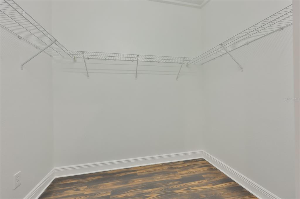 708 Coade Stone Drive Seffner, FL 33584 - Photo 31 of 48 a view of a room with racks on the wall