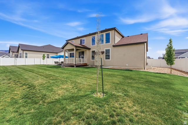 1434 West Stable Street Lindon, UT 84042 - Photo 52 of 76 Back of house featuring a wooden deck, a fenced backyard, and stucco siding