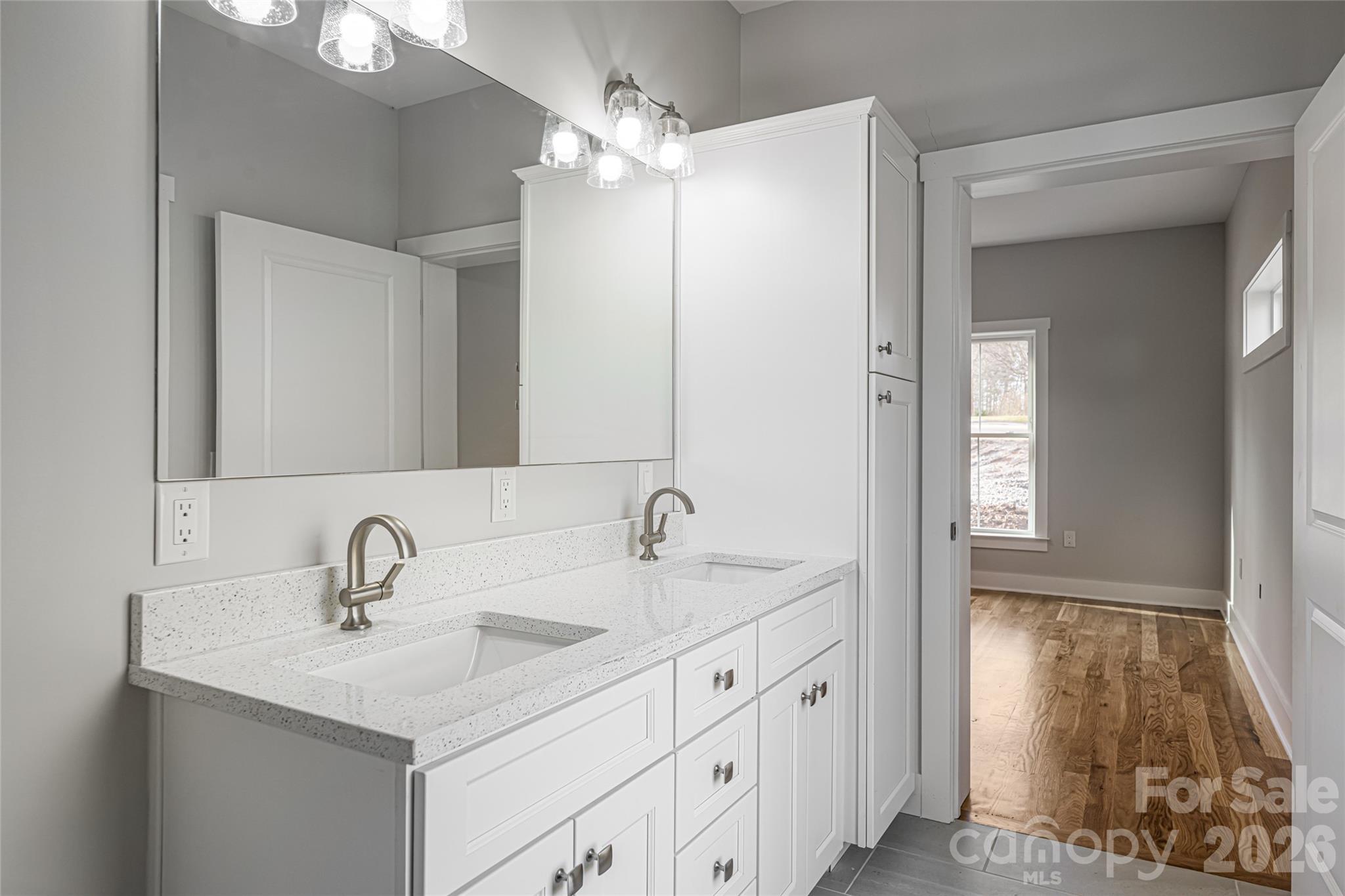 93 Locust Grove Road Weaverville, NC 28787 - Photo 18 of 26 a bathroom with a sink and a mirror