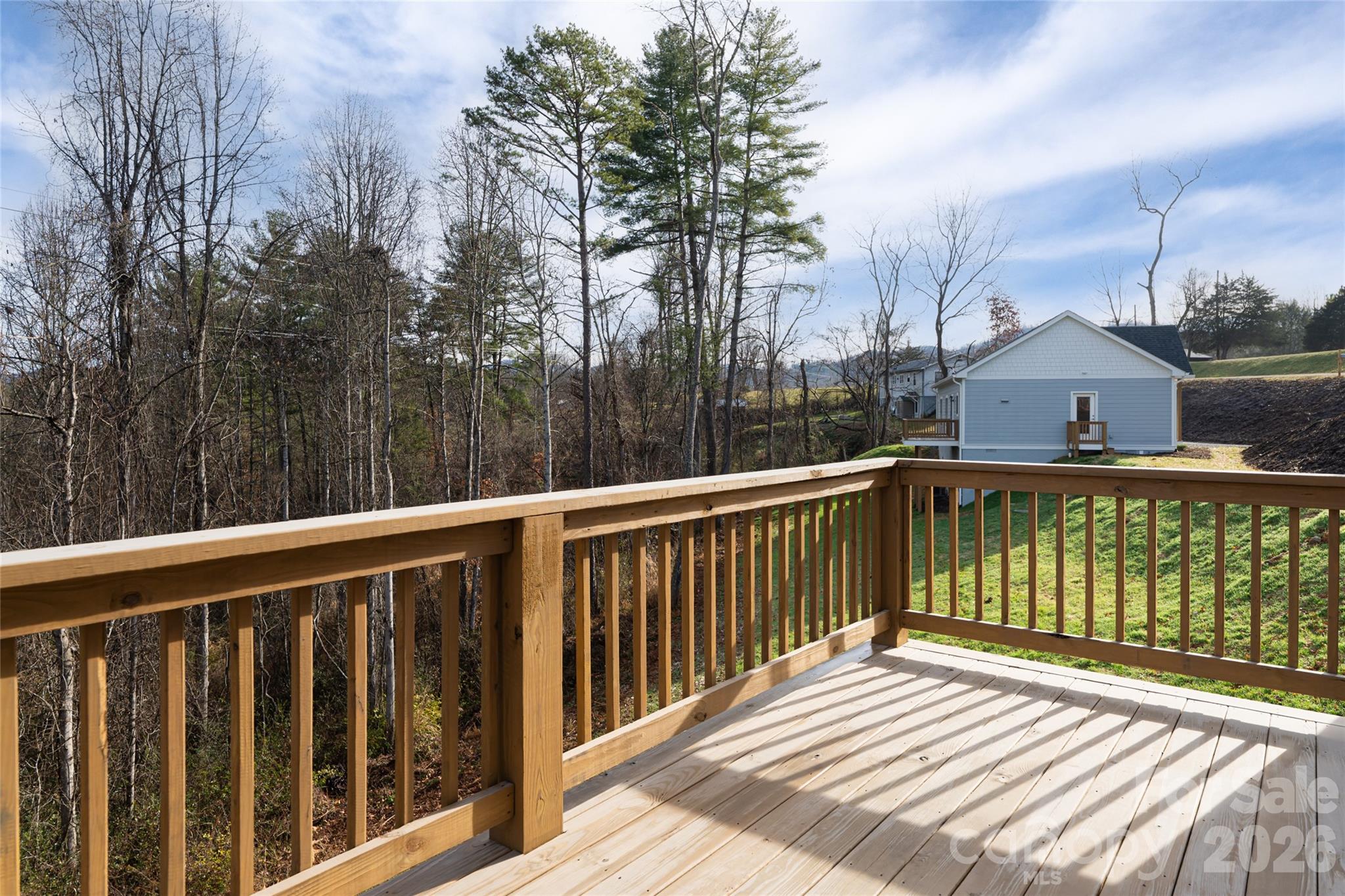 93 Locust Grove Road Weaverville, NC 28787 - Photo 24 of 26 a view of a wooden roof deck