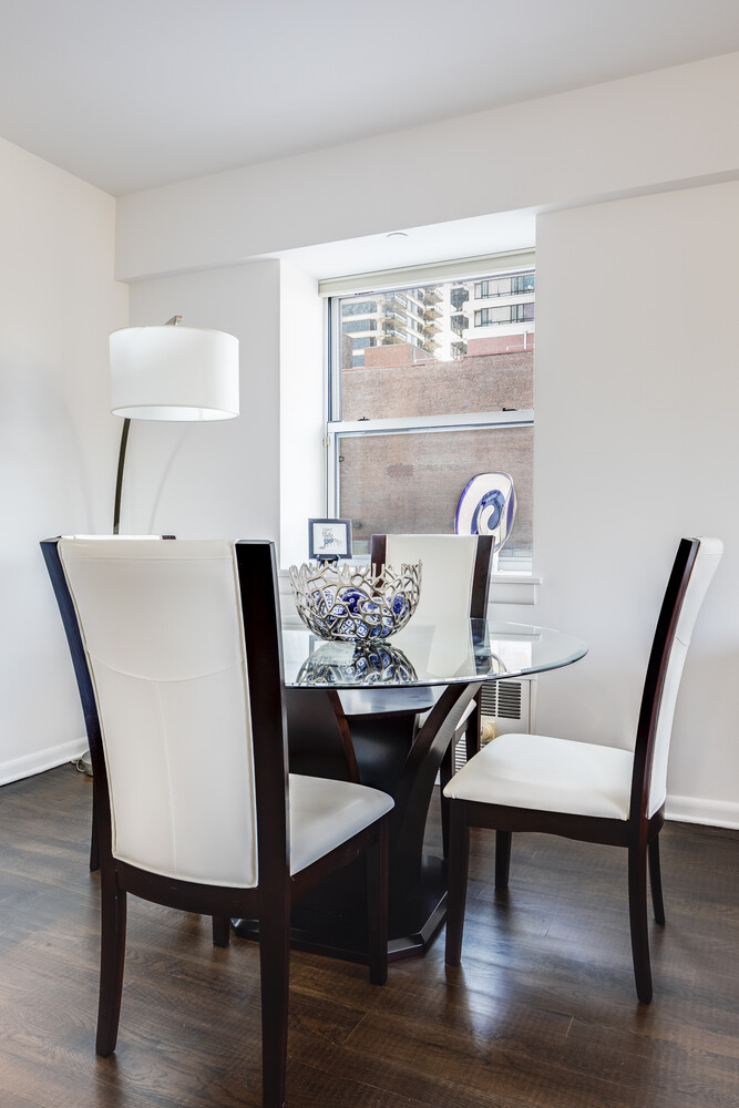2279 3rd Avenue, Unit 4A Manhattan, NY 10035 - Photo 5 of 8 a view of a dining room with furniture and wooden floor