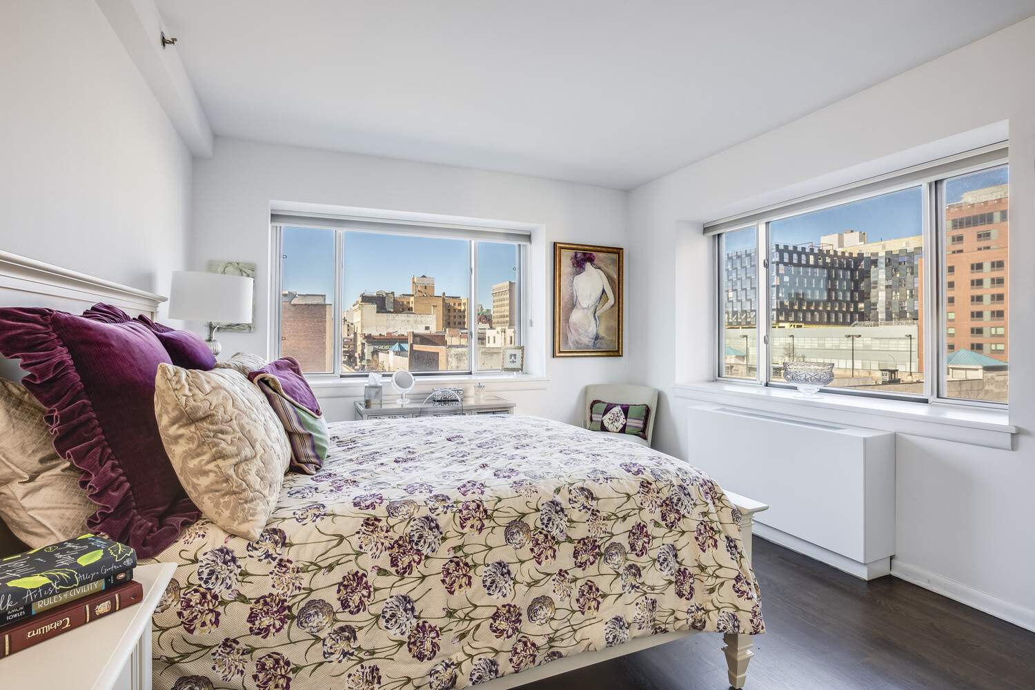 2279 3rd Avenue, Unit 4A Manhattan, NY 10035 - Photo 6 of 8 a bed sitting in a bedroom next to a window