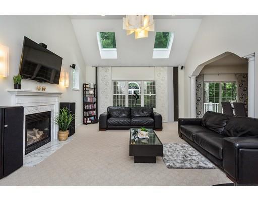 34 Tannery Road Sturbridge, MA 01518 - Photo 3 of 33 a living room with furniture a fireplace and a flat screen tv