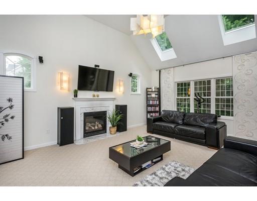34 Tannery Road Sturbridge, MA 01518 - Photo 4 of 33 a living room with furniture a fireplace and a flat screen tv