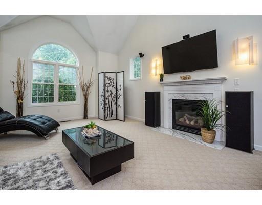 34 Tannery Road Sturbridge, MA 01518 - Photo 5 of 33 a living room with furniture a fireplace and a flat screen tv