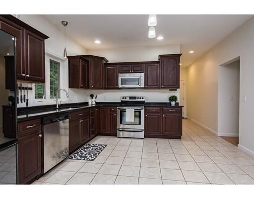 34 Tannery Road Sturbridge, MA 01518 - Photo 9 of 33 a kitchen with stainless steel appliances granite countertop a stove a sink dishwasher and a refrigerator