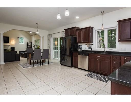 34 Tannery Road Sturbridge, MA 01518 - Photo 10 of 33 a kitchen with stainless steel appliances kitchen island granite countertop a refrigerator and cabinets