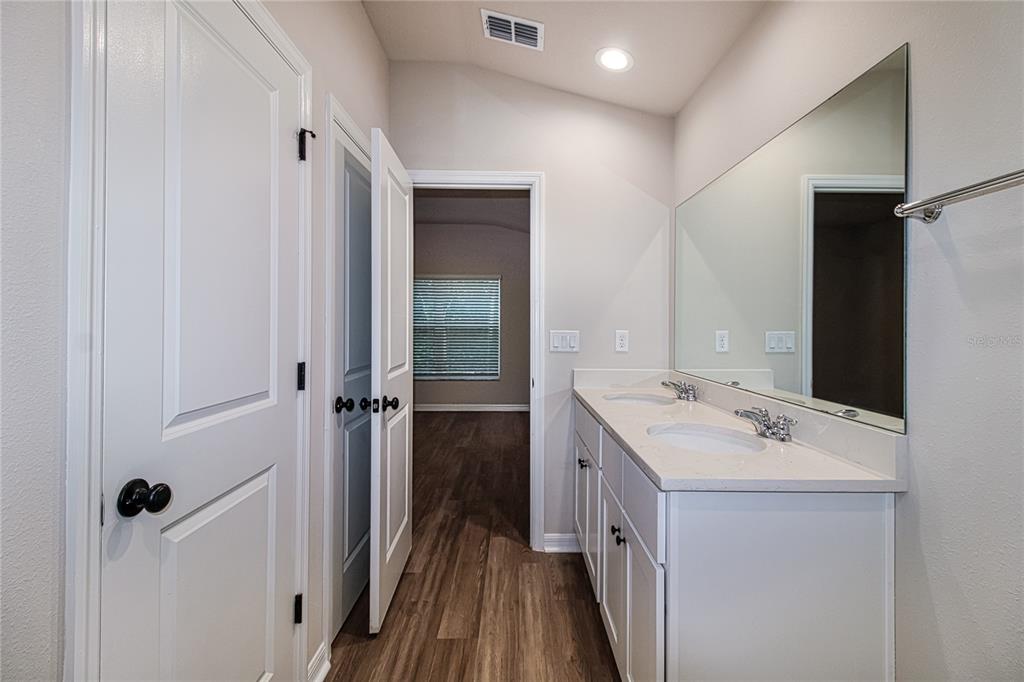 46 Ash Road Ocala, FL 34472 - Photo 13 of 20 a bathroom with a sink a mirror and a shower