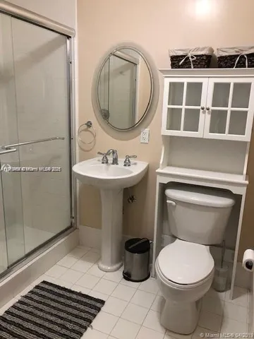 a bathroom with a toilet and a sink