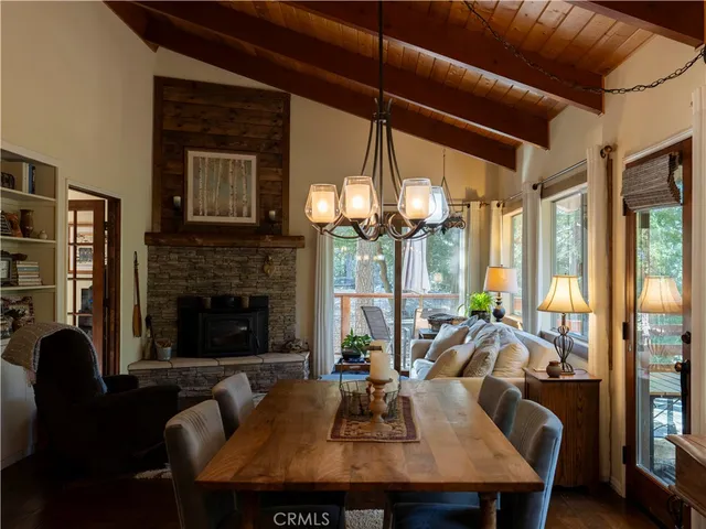a kitchen with stainless steel appliances kitchen island granite countertop a refrigerator and a sink