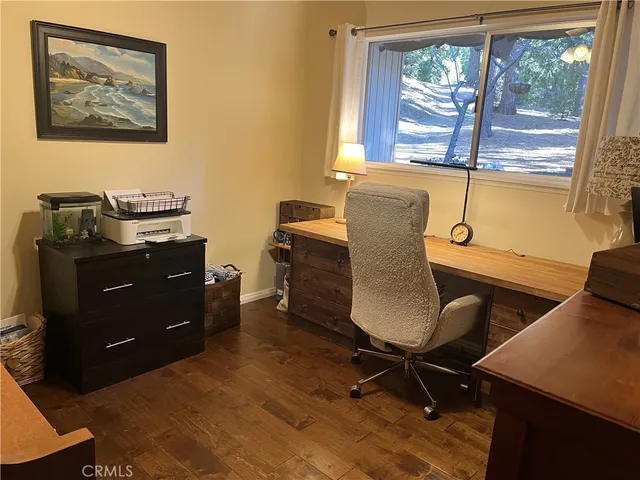 a bathroom with a sink mirror and a toilet