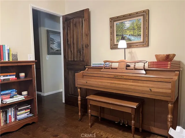 a view of a house with a large tree